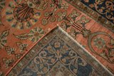 Antique Mohajeran Sarouk rug's folded corner, showing hand-knotted foundation and floral field.