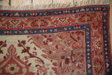 Fine Malayer rug corner with sapphire blue, ruby red borders and beige floral motifs.