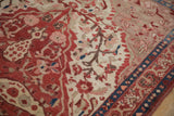 Fine Mishan Malayer rug with ruby red blossoms, sprawling vines, subtle abrashes, and sapphire blue border.