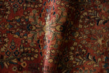 Close view of the soft patina and short wool pile on a vintage Sarouk rug with floral bouquets.