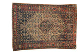 Antique Senneh rug featuring a diamond medallion, dense Herati field, in antique ivory, navy, and brick red, 3'8