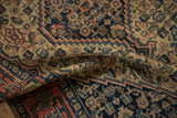 Textured pile of an antique Senneh rug, revealing detailed Herati design in ivory, navy, brick.