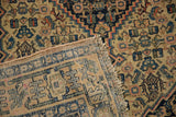 Geometric Herati pattern on worn antique Senneh rug pile, revealing foundation and original side cording.