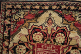 Cochineal red inscription cartouche and ivory corner spandrel on an antique Yezd rug.