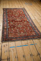 Angled perspective of a vintage Lilihan rug, displaying its detailed floral pattern and boteh border.