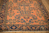Antique Lilihan rug border featuring unique navy Herati mahi-mahi motif with fringe.