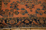 Antique Lilihan rug's dark blue border with detailed Herati shrimp-like fish motifs and fringe.