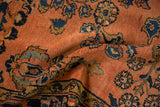 Textural surface of antique Lilihan rug showing sapphire, gold, and dusty rose floral sprays.
