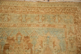 Close view of the short pile, geometric border, and fringe on a distressed vintage Afshar rug.
