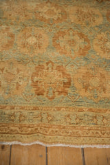 Characteristic short pile and gentle waviness of a distressed vintage Afshar rug.