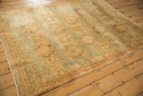Soft, short pile of a vintage distressed Afshar rug with coffee and powder blue medallions.