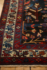 Close-up of a vintage Bakhtiari's Tree of Life motif and detailed borders in gem-like tones.