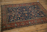 Full angled view of a c. 1920s Persian Farahan Sarouk, displaying its floral field and intricate borders.