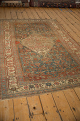 Abrashed Bijar rug field with stepped medallion in dusty teal and burgundy tones.