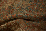 Distressed texture of antique Bijar rug, showcasing abrashed dusty teal and burgundy Herati motifs.
