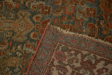 Distressed teal and burgundy pile, hand-knotted construction, and fringed edge of an Antique Bijar rug.
