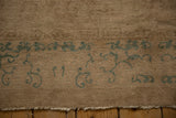Traditional antique Peking rug, seafoam green scrolling border, beige short pile edge.