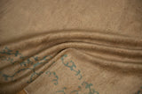 Mostly even short pile of antique Peking rug, with seafoam green scrolling tendrils.