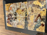 Angled side view of Lillian Shad's framed art, highlighting its dimensional layers.