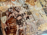 Detail of layered mixed media art with vintage photos, sheet music, and gold leaf.