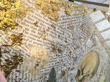 Angled detail of the mixed media art showing textured gold leaf over printed text.