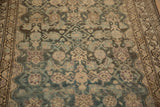 Low pile texture and heavy abrashes across the Mahi Mahi design of the vintage Hamadan rug.