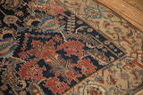 Detailed view of an antique Malayer rug showing stylized leaves and a fine low-pile texture.