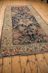 Angled perspective view of the antique Malayer runner, showing the full length and design layout.