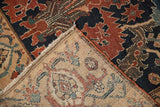 Folded corner of an antique Malayer rug revealing its hand-knotted foundation and pile texture.