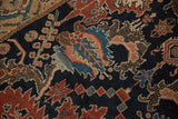 Close-up of finely knotted dragon stylized leaves with checkered details on a navy blue field.