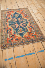 Antique Senneh rug corner with fringe, triple borders, and scrolled gul farang motifs.