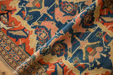 Intricate triple column border and scrolled gul farang motifs on folded antique Senneh rug.
