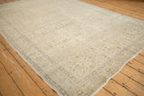 Vintage distressed Kaisary rug corner, with faded blue border and allover floral vines.