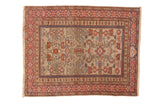 A vintage Shirvan square rug with an allover Perpedil design and Kufic borders in rust, blue, and silver.