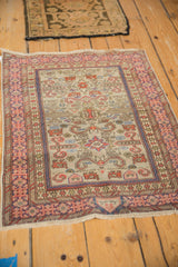 Vintage Shirvan mat with ram's horn and Kufic border motifs in rust, blue, and silver tones.