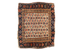 Antique Kurdish square mat with a geometric cloudband trellis in saturated red and navy blue.