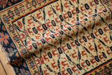 Evenly worn, low pile of an antique Kurdish rug showing its hand-knotted texture and geometric motifs.