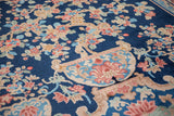 Ornate potted base of the Tree of Life motif on a vintage Chinese Art Deco carpet.