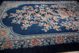 Low angle view of the sprawling Tree of Life on a vintage cobalt blue Art Deco carpet.