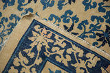 Detail of the hand-knotted foundation and threadbare selvage on an antique Peking carpet.