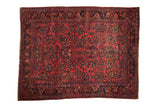 Antique Persian Sarouk carpet with allover floral sprays in raspberry red and deep navy blue.