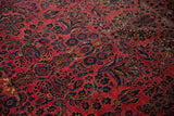 Low pile texture of an antique Sarouk showing wear lines and white knots within the floral sprays.