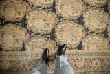 European-influenced Rococo panels and time-softened low pile of an antique Tabriz carpet.