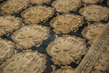 Worn pile of an antique Tabriz carpet with Rococo-style roundels and rose bouquets.