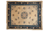Early 20th-century Peking carpet with a central blue medallion and lotus flowers on an ivory ground.