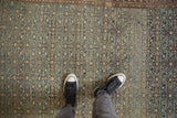 Distressed antique Malayer rug displaying allover Herati pattern with dusty blue and ivory abrashes.