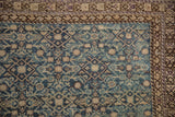 Distressed antique Malayer rug corner, dusty blue Herati field, chocolate geometric vine border.