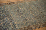 Antique Malayer rug's distressed Herati motif field with heavy abrashes, dusty blue and ivory.