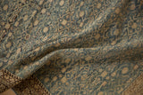 Distressed antique Malayer rug detail: textured dusty blue and ivory Herati motif with patterned border.