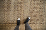 Distressed vintage Malayer rug with faded beige, oxidized silver, and Herati design.